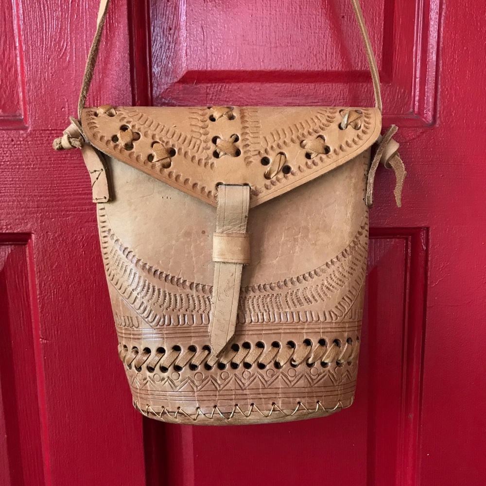 Raw tan hard leather crossbody